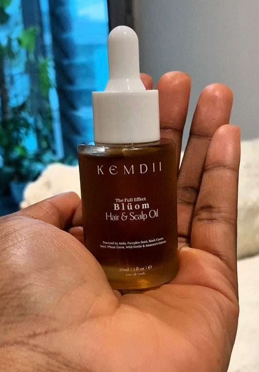 BLÜOM hair and scalp oil bottle shown in hand for dry itchy scalp