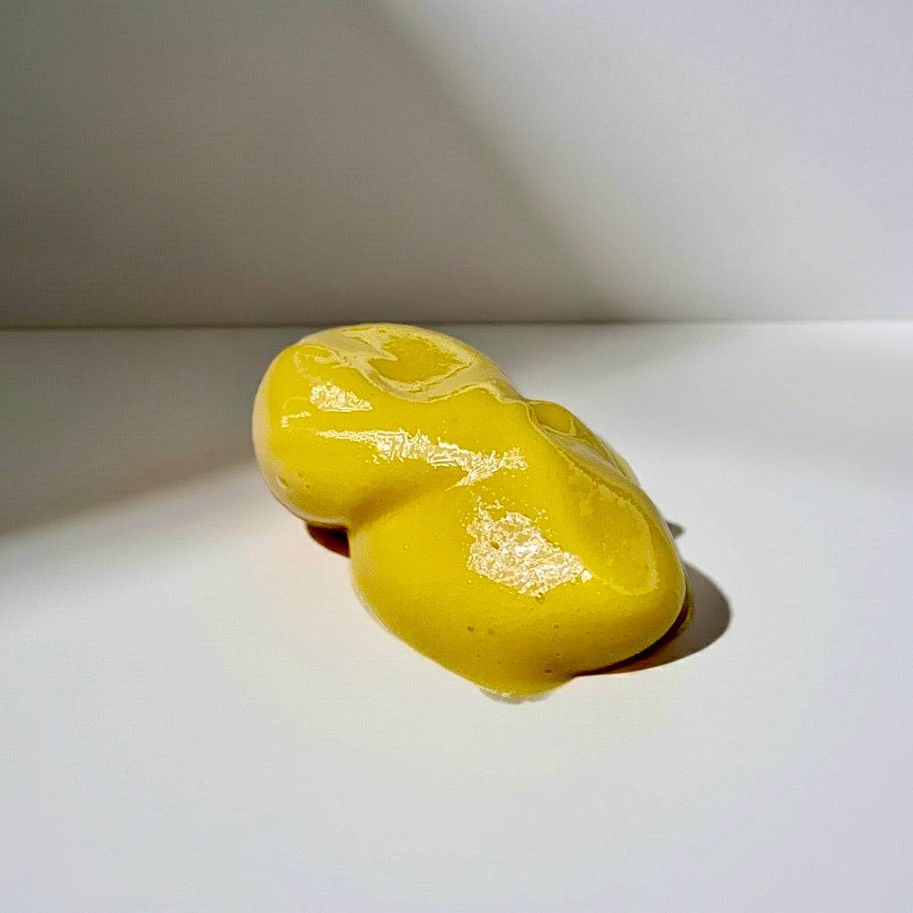 Close-up of KEMDII HydraRepair Scalp Cream texture showing a rich, smooth yellow cream formulated for dry and sensitive scalps