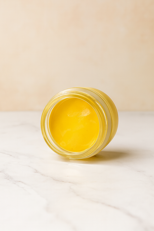 Open jar of HydraRepair Scalp Cream showing its rich yellow texture, formulated to soothe dry, itchy, and sensitive scalps