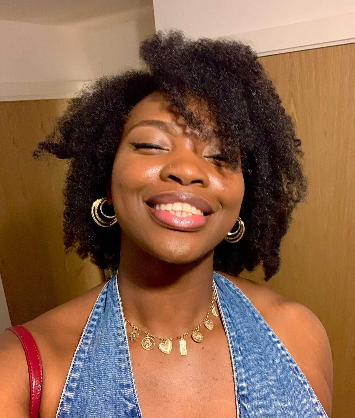 Woman with natural textured hair showing softness, definition, and healthy-looking curls