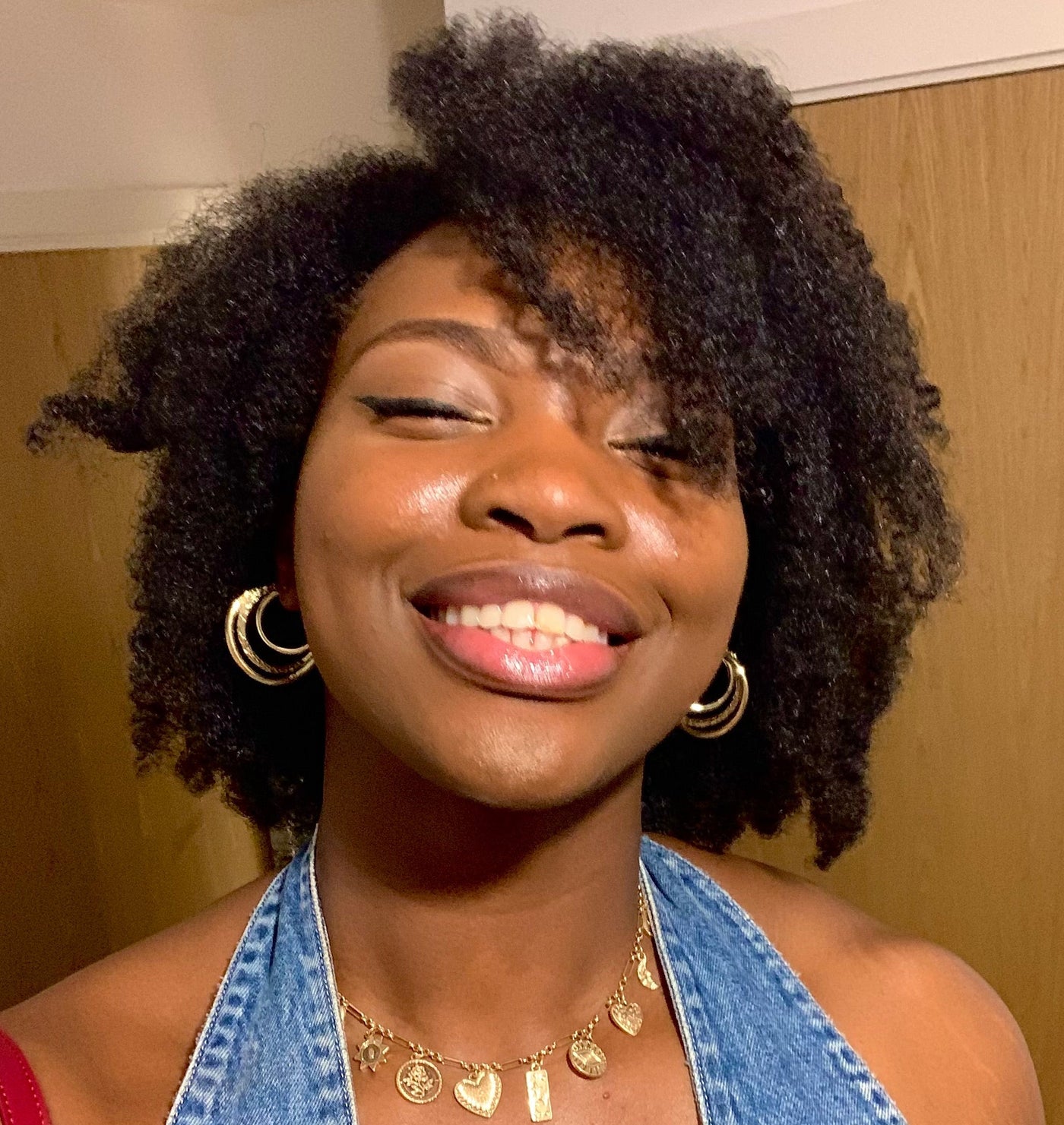 Woman with natural textured hair showing softness, definition, and healthy-looking curls